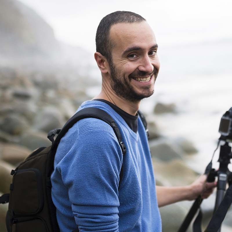 Spain valdovino portrait of smiling photographer MCVUFZT e1703858165255.jpg